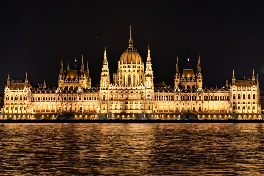 Hungarian Parliament illuminated at night by the Danube