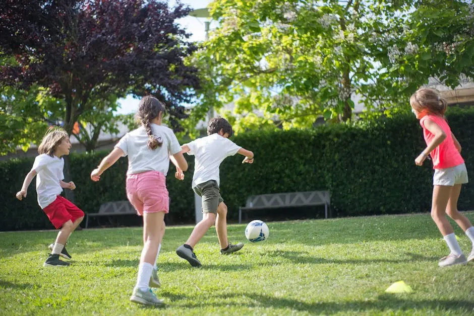 Children playing football on a garden lawn
