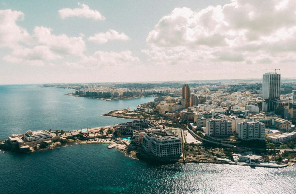 an aerial view of a city and a body of water