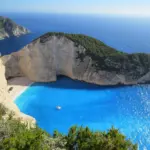 Beach with umbrellas by the Mediterranean in summer