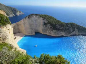 Beach with umbrellas by the Mediterranean in summer