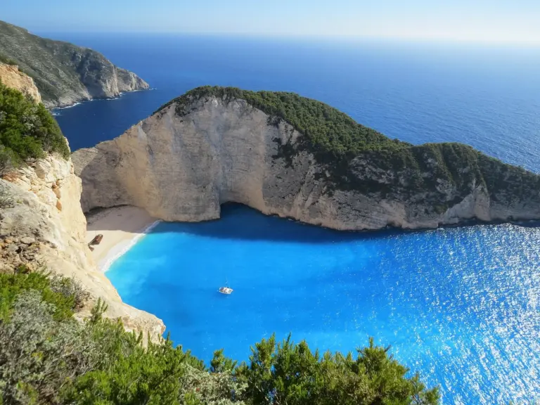 Beach with umbrellas by the Mediterranean in summer