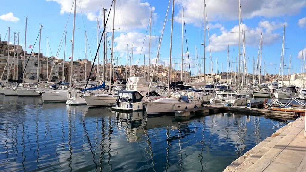 Boats in Msida marina with apartment blocks behind, Malta