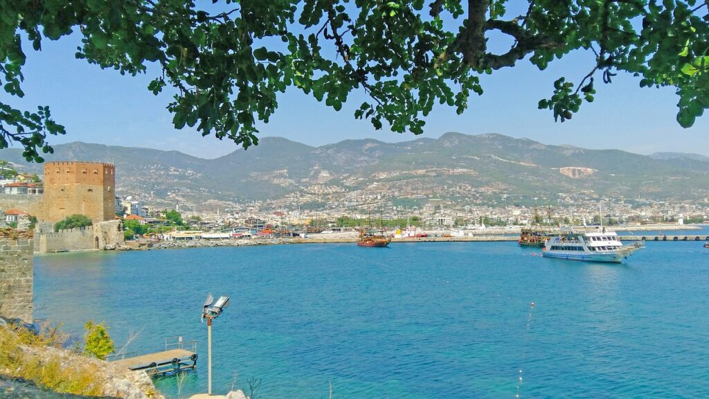 Boats in the harbour beside the Red Tower in Alanya