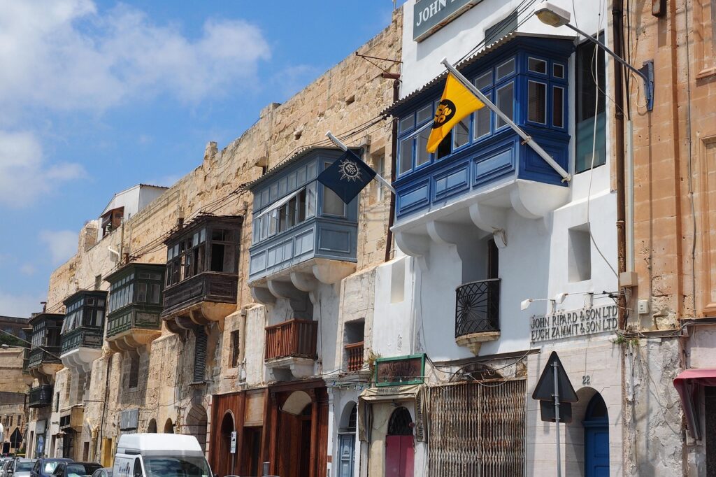Busy Republic Street with shops and cafes in Valletta, Malta