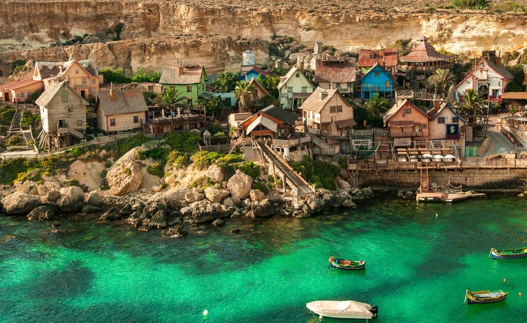 Calm sea and limestone shore at Mellieha Bay, Malta