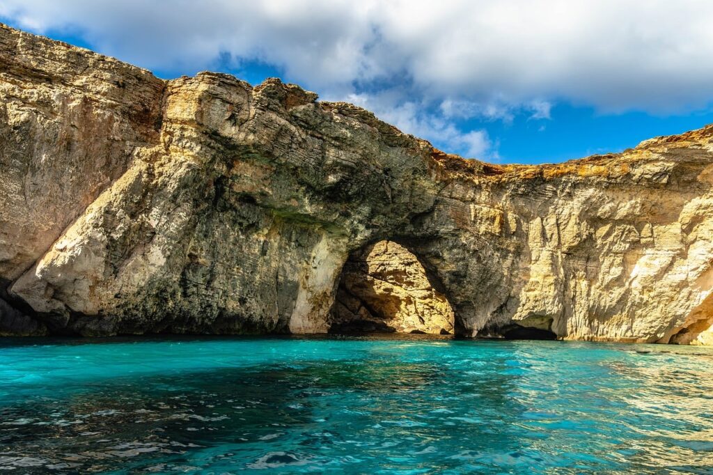Catamaran anchored in the turquoise Blue Lagoon at Comino, Malta
