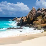 Granite boulders and white sand on a beach in the Seychelles