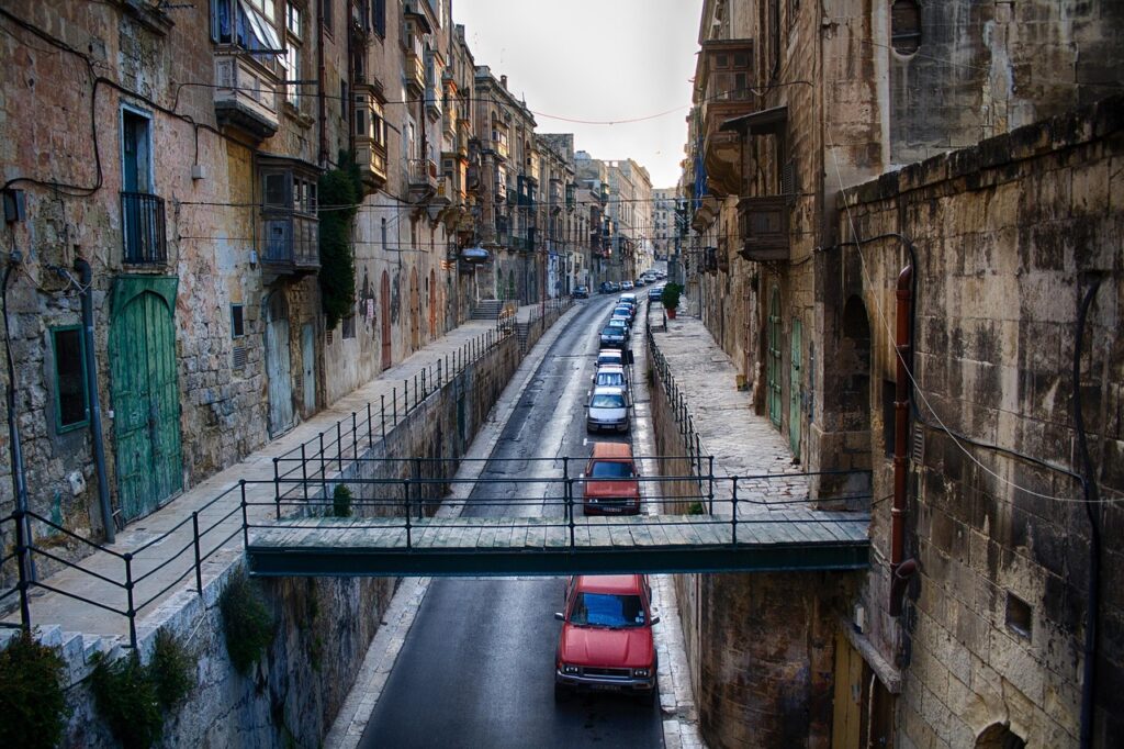 Narrow alley between old buildings in Valletta, Malta