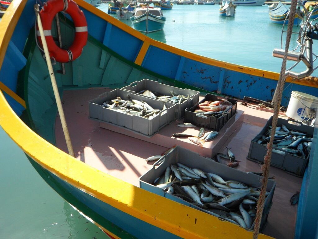Sunday market stalls on the waterfront of Marsaxlokk, Malta