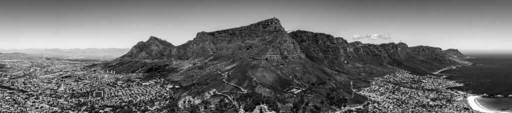 Table Mountain rising above Camps Bay beach in Cape Town