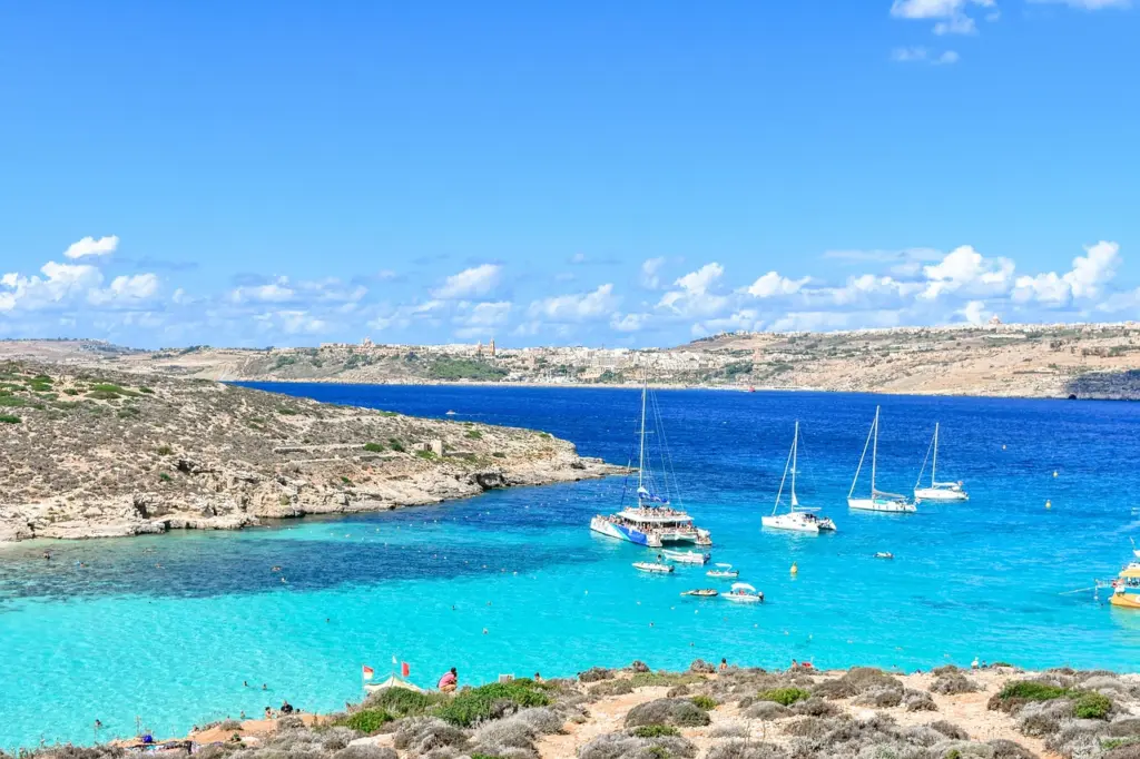 Turquoise water and boats in the Blue Lagoon on Comino