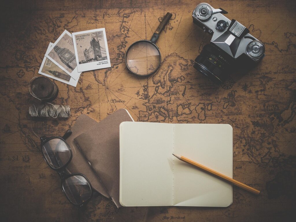 Vintage map and notebook on a desk for trip planning