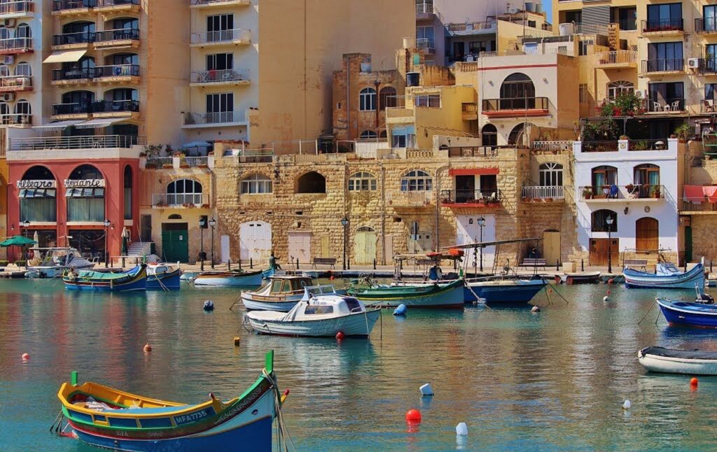 Yachts moored in the Grand Harbour below Valletta's fortifications, Malta